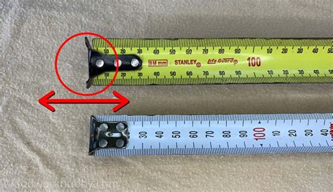 wiggly metal bracket on the end of a tape measure|loose end of tape measure.